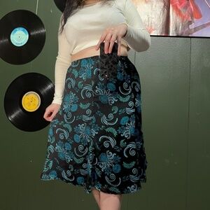 Blue and black floral midi skirt with elastic waist. Slips on.  size 16